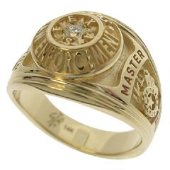 A custom Houston Police Sergeant's professional ring in 14k yellow gold with a 0.08 ct. round brilliant diamond.