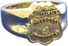 14k yellow gold custom police chaplain's badge ring with black text and diamond center stone