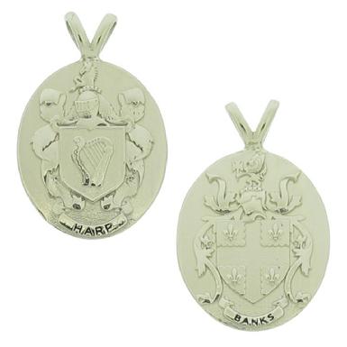 Custom Family Crest pendants in 10k white gold with sculpted relief detail.